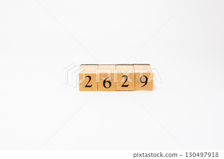 Product photography of numbers lined up on wooden blocks 2629 130497918