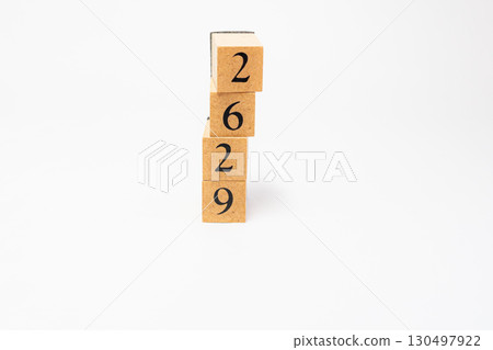 Product photography of numbers lined up on wooden blocks 2629 130497922