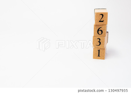 Product photography of numbers lined up on wooden blocks 2631 130497935