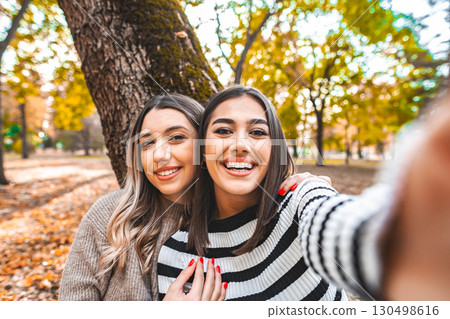 Two Women Taking a Selfie in a Park 130498616