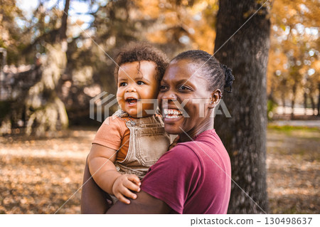 Mother's Embrace: Joyful Moments in the Park 130498637