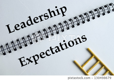 Leadership Expectations, Notebook with ladder illustration symbolizing guidance, responsibility, and influence. Leadership Expectations, Notebook with ladder illustration symbolizing guidance, responsibility, and influence. 130498679