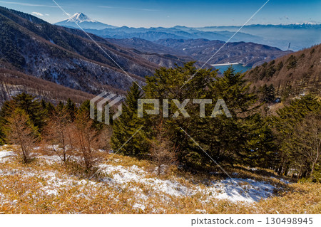 Mount Fuji and Lake Daibosatsu seen from the climb up Ishimaru Pass in the Daibosatsu Range 130498945