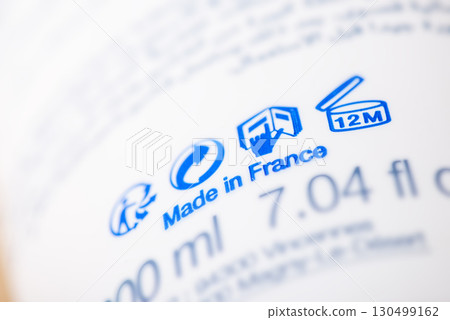 Close up of bottle with inscription Made in France. Manufacturing some cosmetics or other goods in France concept 130499162