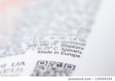 Close up on Made in Europe inscription on bottle of some cosmetics. Manufacturing products in Europe concept 130499164