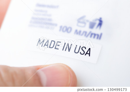 Close up of bottle with inscription Made in USA. Production of goods in USA concept Close up of bottle with inscription Made in USA. Production of goods in USA concept 130499173