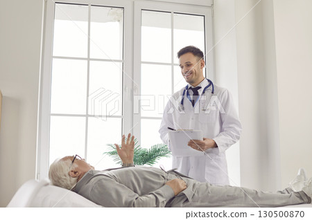 Elderly Man Seeking Medical Advice from Doctor 130500870