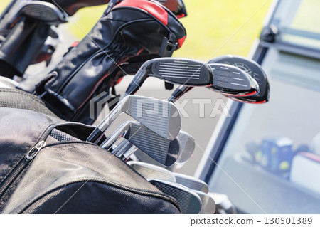 A lot of golf clubs in a cart A lot of golf clubs in a cart 130501389