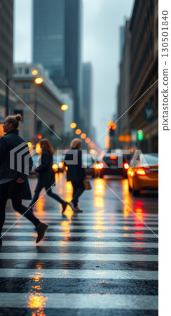 A lot of people walk along the pedestrian crossing during rush hour 130501840