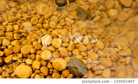 Wet pebbles on the beach Wet pebbles on the beach 130501987