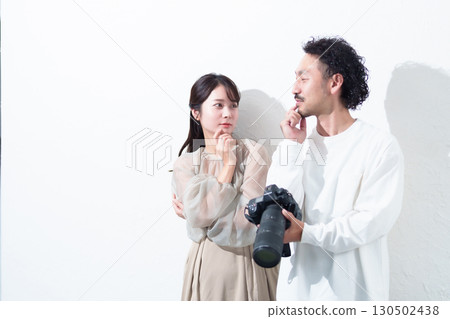 Photographer and model instructing posing Photographer and model instructing posing 130502438