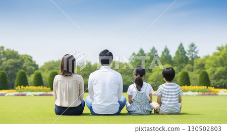 Family sitting on the grass 130502803