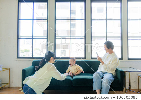 A family taking pictures of their daily lives with a smartphone A family taking pictures of their daily lives with a smartphone 130503085