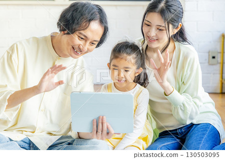 Family making videophone call 130503095