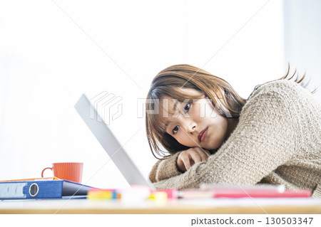 Young woman tired of work 130503347