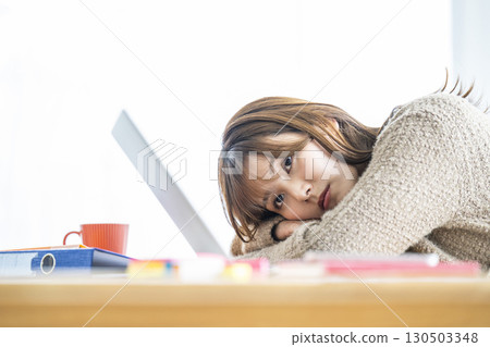 Young woman tired of work 130503348