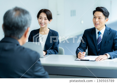 Senior man receiving an interview Senior man receiving an interview 130503789