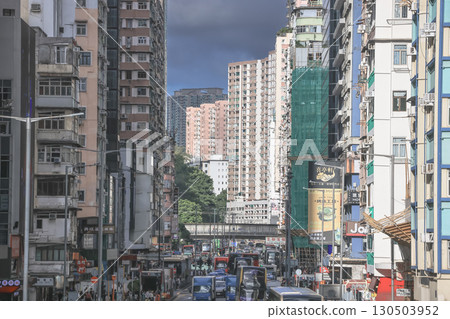 Aug 30 2025 Busy Urban City Street With Pedestrians and Traffic 130503952