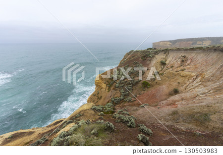 The Bakers Oven so called for the shape of the natural arch in the cliff face. A sea stack on the coast of the Great ocean Road, Australia. 130503983