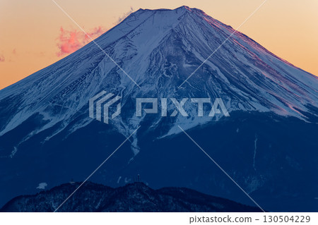 Mount Fuji in the afterglow as seen from Shiratani-no-maru on the Daibosatsu mountain range Mount Fuji in the afterglow as seen from Shiratani-no-maru on the Daibosatsu mountain range 130504229