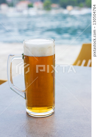 Delicious draft beer in the evening at a European resort Delicious draft beer in the evening at a European resort 130504764