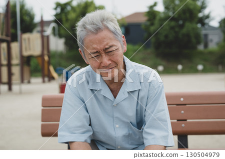 Senior men sitting on the bench 130504979
