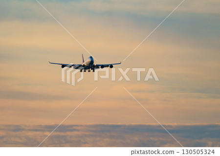 Airplane, clouds with various expressions, evening sky, 747, sunrise 130505324