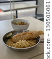 Delicious crispy fish fillet and pasta in a bowl and pan 130506061