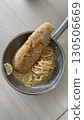 Delicious crispy fish fillet and pasta in a hot pan 130506669