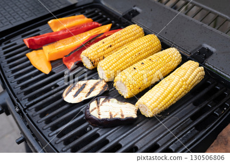 Grilled corn and vegetables on barbecue grill summer cooking 130506806