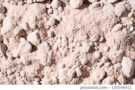 Edible indian black salt in pile, close up view showing its coarse texture. 130506911