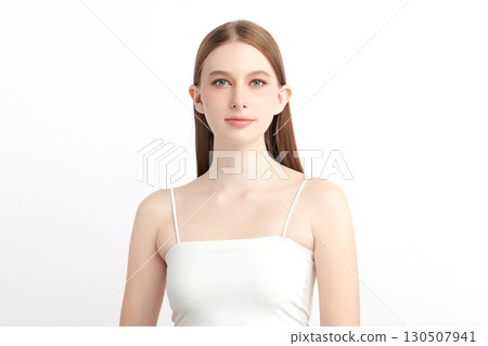 A beautiful young Asian woman with clean, fresh skin against a white background. Skincare, facial treatment, cosmetology, beauty, and spa. An elegant portrait of an Asian woman. 130507941