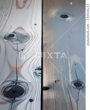 Close up of Wooden Planks Showing Natural Knots and Wood Grain Texture in Gray and Brown Hues Close up of Wooden Planks Showing Natural Knots and Wood Grain Texture in Gray and Brown Hues 130508211
