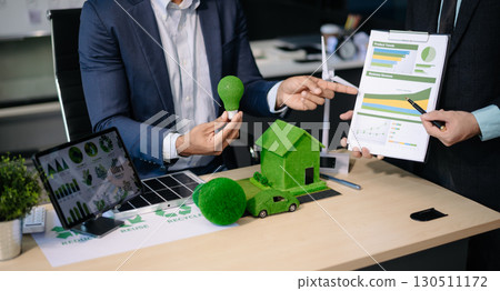 business team people planning and discussing on recycle reduce reuse policy symbol in office meeting room. Green business company business team people planning and discussing on recycle reduce reuse policy symbol in office meeting room. Green business company 130511172