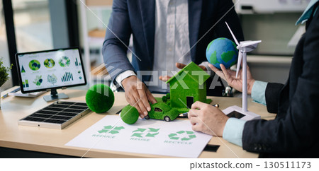 Business team people planning hand using laptop for working technology and business Net zero and carbon neutral concept.NET ZERO Business team people planning hand using laptop for working technology and business Net zero and carbon neutral concept.NET ZERO 130511173