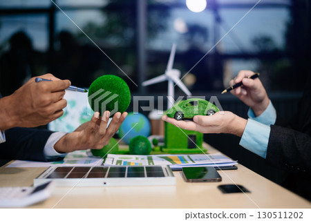 business team people planning and discussing on recycle reduce reuse policy symbol in office meeting room. Green business company business team people planning and discussing on recycle reduce reuse policy symbol in office meeting room. Green business company 130511202