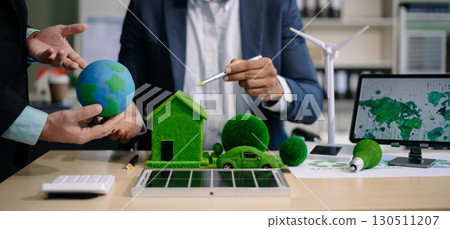 business team people planning and discussing on recycle reduce reuse policy symbol in office meeting room. Green business company business team people planning and discussing on recycle reduce reuse policy symbol in office meeting room. Green business company 130511207