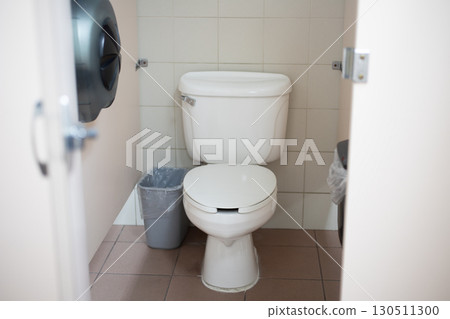 A toilet stall with an open partition in America. 130511300