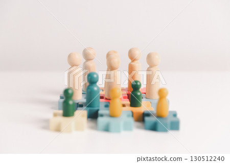 Concept of diversity, inclusion, equality is highlighted in team setup, wooden elements, symbolizing leadership, authority, influence, strong communication skills, inclusive organizational structure. Concept of diversity, inclusion, equality is highlighted in team setup, wooden elements, symbolizing leadership, authority, influence, strong communication skills, inclusive organizational structure. 130512240