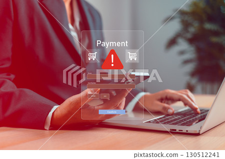 Businessman using smartphone with online payment warning alert on virtual screen, concept of credit card fraud, phishing scam, cybersecurity threat, data theft, e-commerce risk and digital protection. 130512241