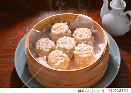 Note: Steam is synthetic. Shumai, Chinese food, steamed in a bamboo steamer. 130512263