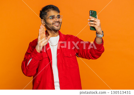 Happy Indian man blogger take portrait selfie record video call online with social media subscribers 130513431