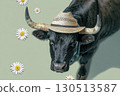 the bull with a straw hat on his head 130513587