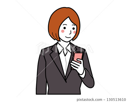 Charcoal suit. Woman looking at smartphone Charcoal suit. Woman looking at smartphone 130513610