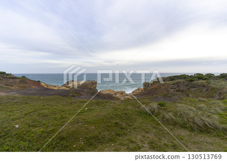 Walking path graveled in green bushes at 12 Apostles National Park Victoria, Australia. 130513769
