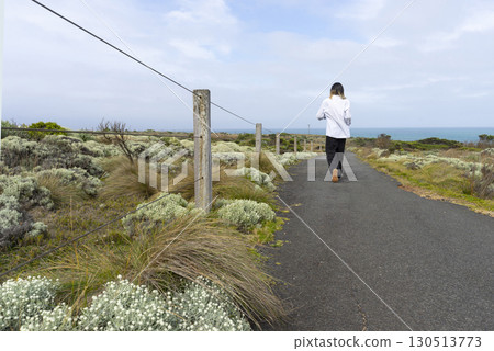 Walking path graveled in green bushes at 12 Apostles National Park Victoria, Australia. 130513773