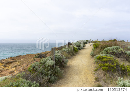 Walking path graveled in green bushes at 12 Apostles National Park Victoria, Australia. 130513774