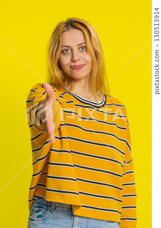 Caucasian woman outstretching hand to camera, offering handshake, greeting, invitation, welcoming 130513914