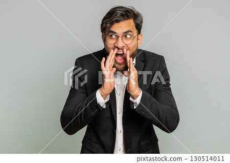 Indian businessman whisper news rumors holding hands near mouth, share gossip quiet, keep my secrets 130514011