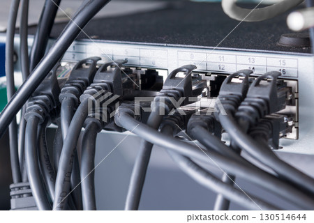 black ethernet cables connected to switch 130514644